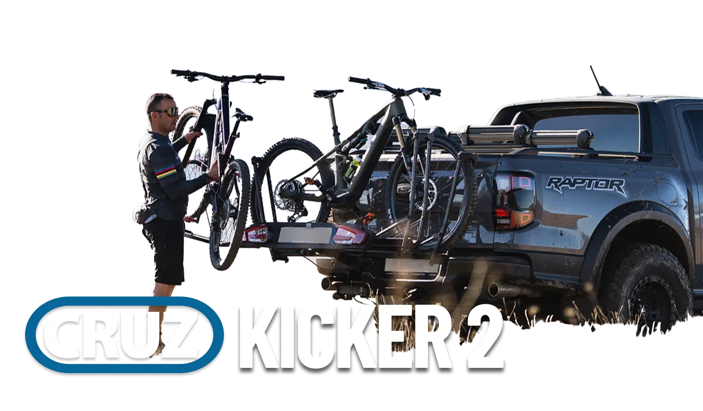 Person loading Cruz Kicker 2 onto bike rack