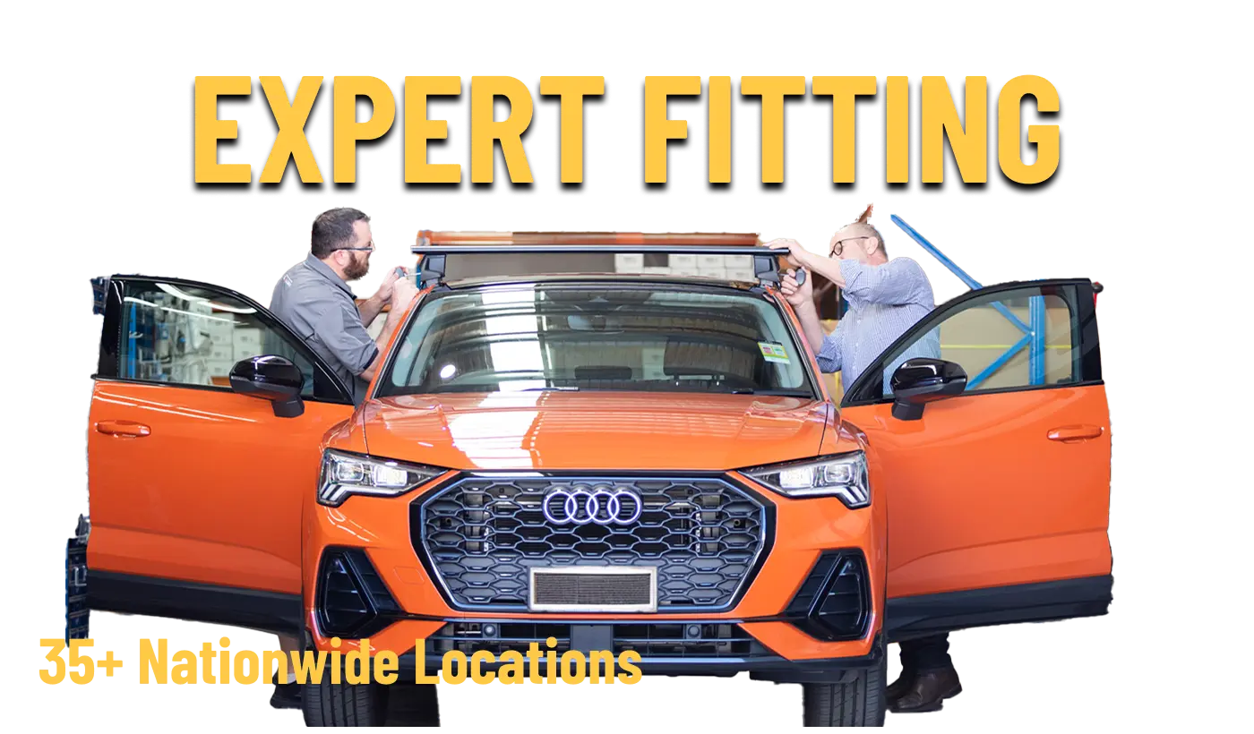Two people fitting roof racks